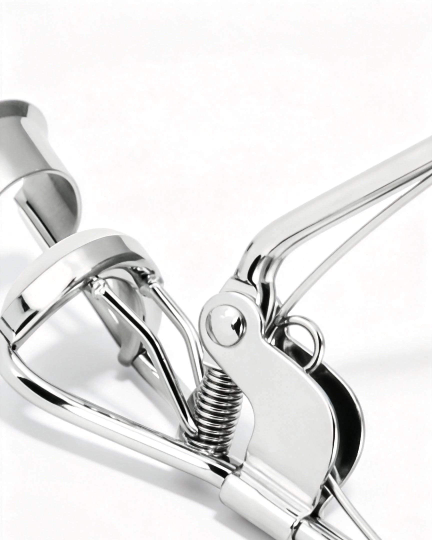 مِكحوَل رموش بمقبض بلاستيكي - رأس تجعيد بزاوية واسعة